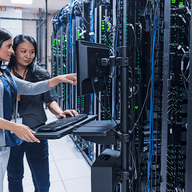 people working in a server room