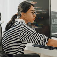 woman monitoring screens
