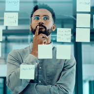 man reading sticky notes