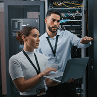 two colleagues in a server room