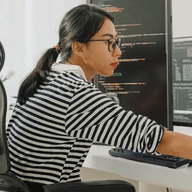 woman working on her work computer
