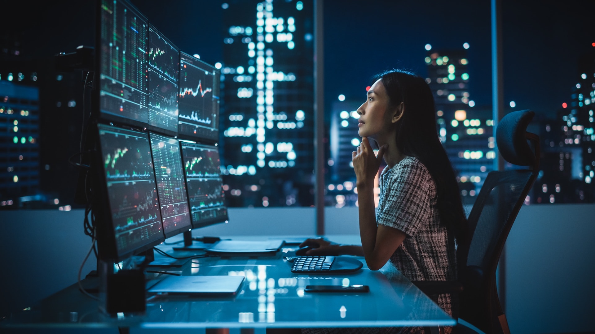 Portrait of a financial analyst working on computer