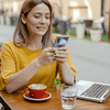 Girl on phone in cafe