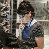 female it engineer working in server room
