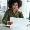 A woman looking at a paper