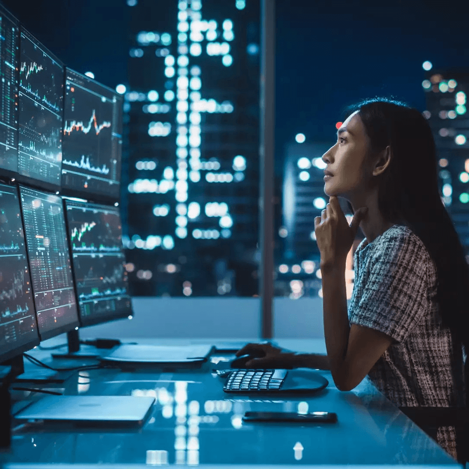 A woman looking at her monitor