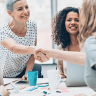 Two women doing hand shake