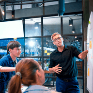 Three people in work presentation