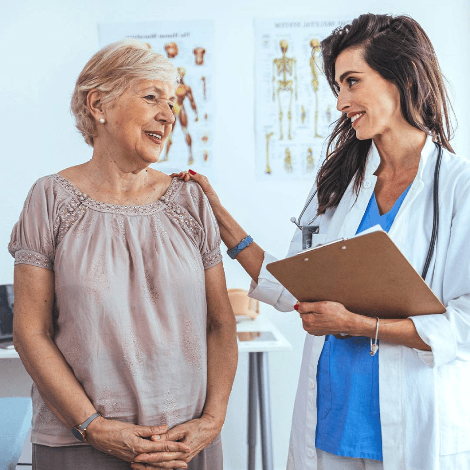 A doctor examining an old woman
