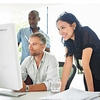 3 people working on a computer