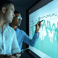 Two analysts reviewing financial data.