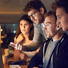 team looking at issue on screen