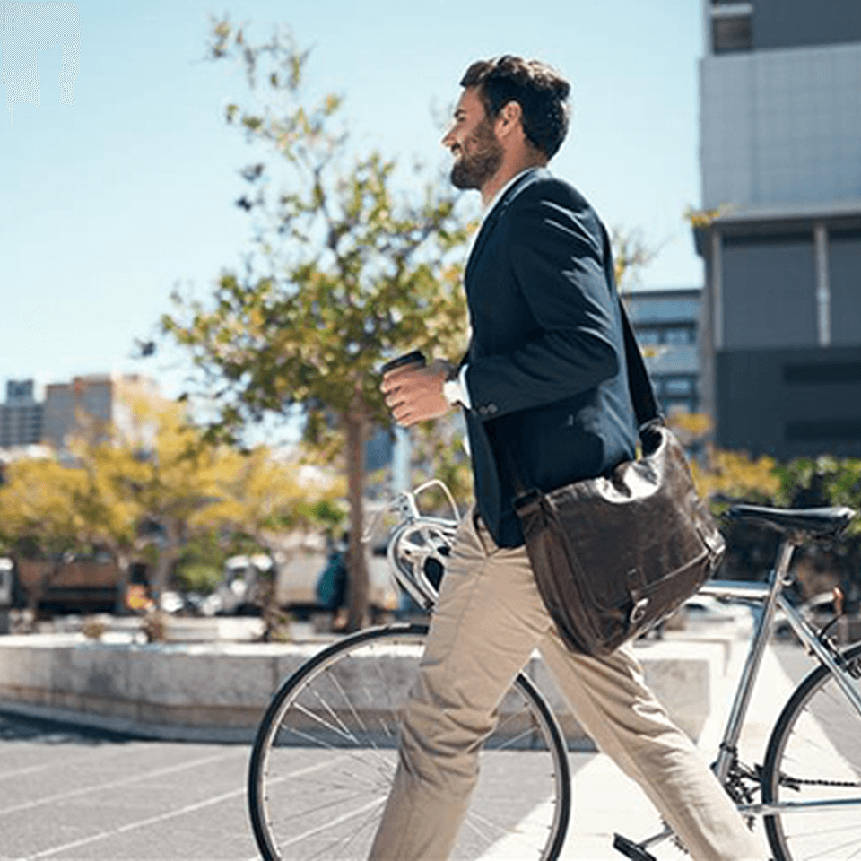A man walking with his bike