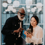 two people looking at a phone together