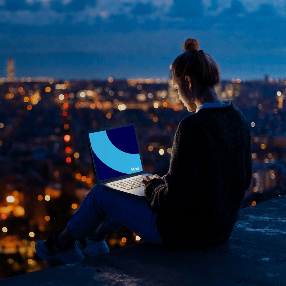 girl in a rooftop using her computer