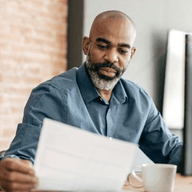 A man looking at a paper