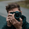 A man holding a camera