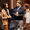 Four men having conversation