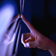 pointing finger at a screen