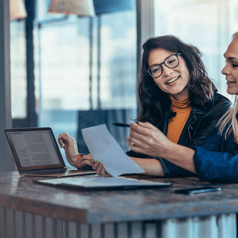 two women working together