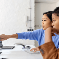 two young software developers working in office