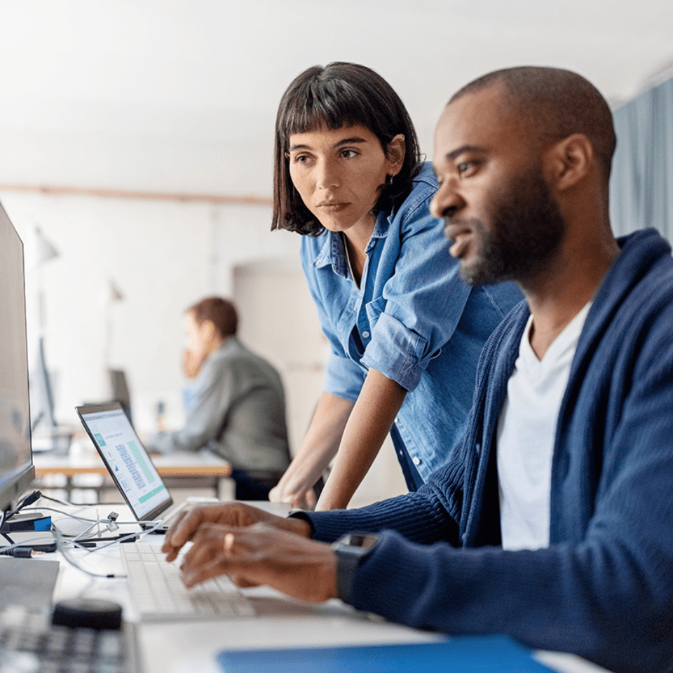 two people working together