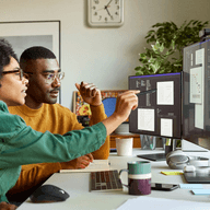 two colleagues analyzing data